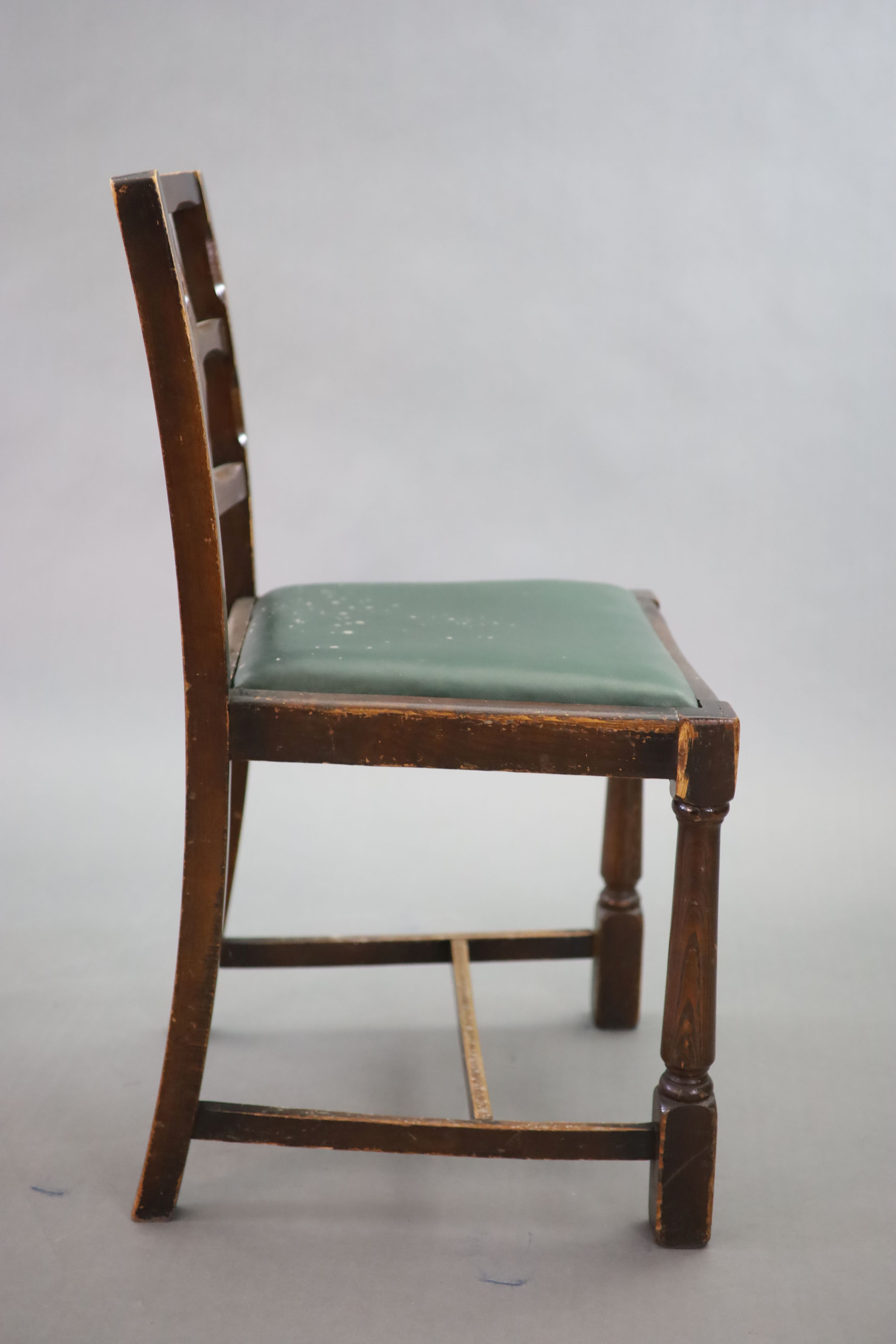 A set of eight early 20th century oak and beech dining chairs